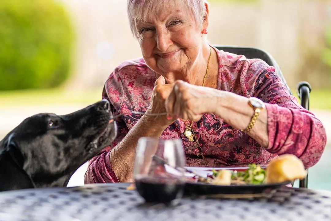 An elderly member of the community enjoys nutritious frozen meal options